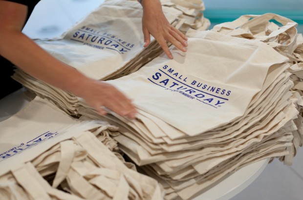 A pile of Small Business Saturday promotional bags.