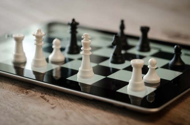 A chess pieces on an iPad.