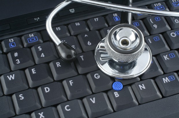 A stethoscope on a laptop keyboard.